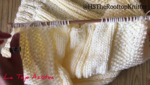 Jersey con trenzas o cables tejido a dos agujas cuello envolvente