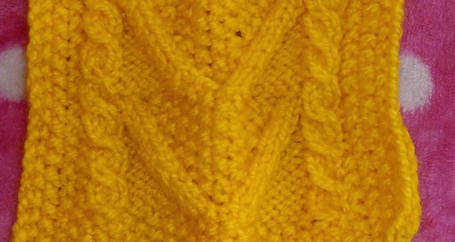 Punto aran tejido en dos palitos